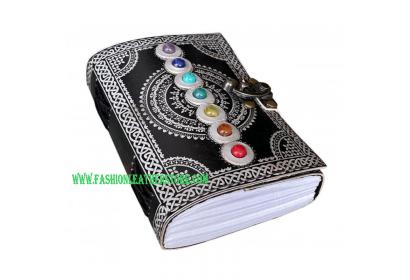 seven stone with back and silver color leather journal
