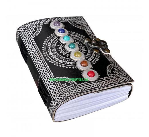 seven stone with back and silver color leather journal